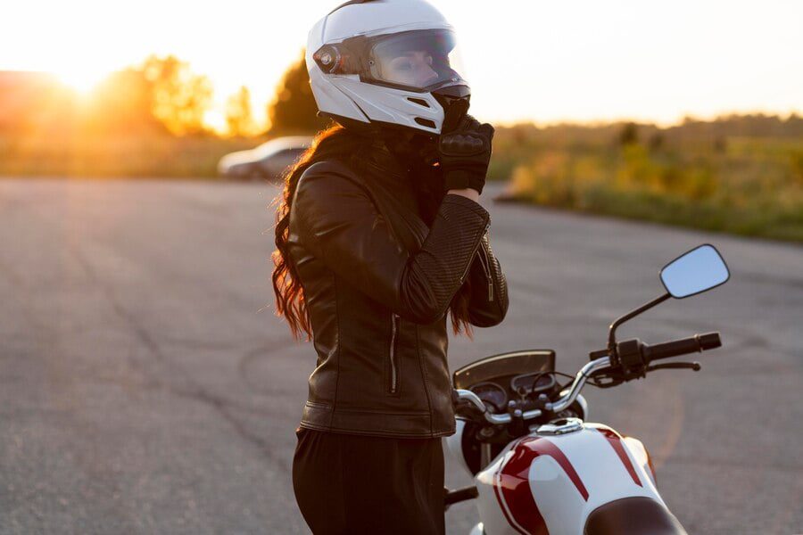 side view woman taking off her helmet motorcycle 23 2148685262 side view woman taking off her helmet motorcycle 23 2148685262