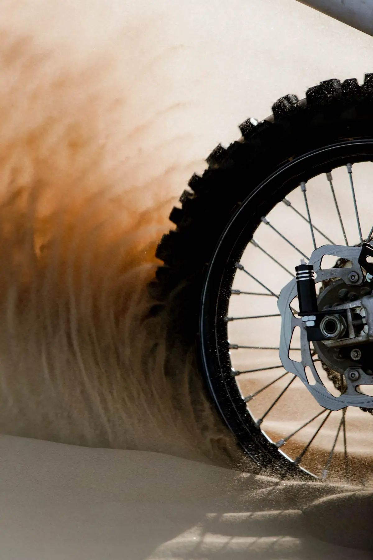 An image of a dirt bike riding through rough terrains