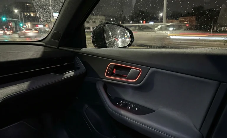 Tesla Model 3 interior showing hidden emergency door release under NHTSA probe